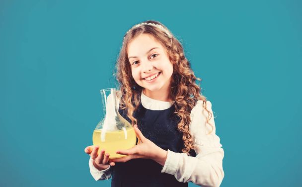 Girl school pupil study chemical liquids. School laboratory. Learn patterns of nature. Education concept. School chemistry lesson. Chemical analysis. Harmful and vital options of chemical solute - Фото, зображення