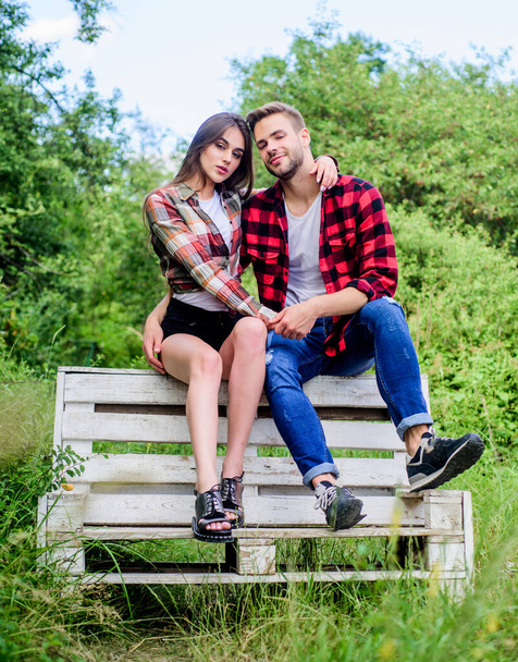 Romantic story. valentines day. summer camping in forest. couple in love. Checkered fashion. man with girl in park. family rancho weekend. romantic date. couple relax outdoor on bench. Love kiss - Foto, Bild