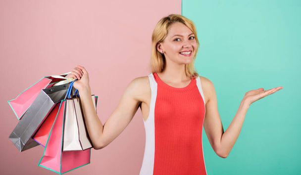 Save money. Easy way of shopping. Woman on shopping tour. Girl with paper bags. Black friday. Happy shopping day. Retail and consumerism. Satisfied with her shopping. Discounts and loyalty program - Fotó, kép