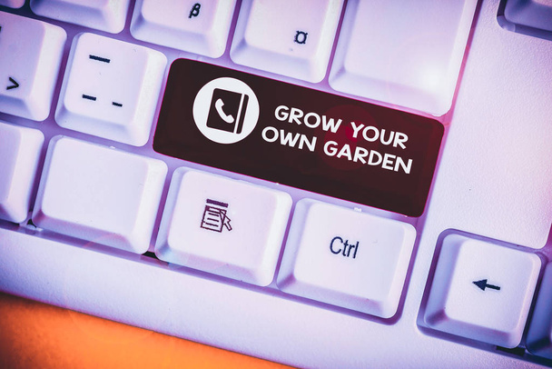 Handwriting text Grow Your Own Garden. Conceptual photo Organic Gardening collect demonstratingal vegetables fruits White pc keyboard with empty note paper above white background key copy space - Photo, Image