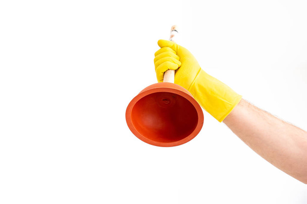 White Caucasian male hand with yellow latex glove holding a sink - Photo, Image