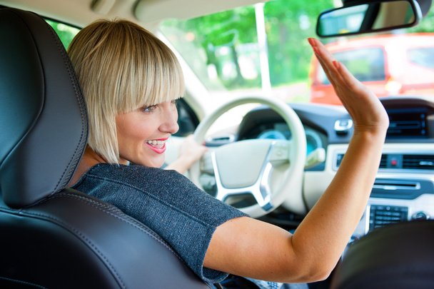 attractive woman driver in her car - Zdjęcie, obraz