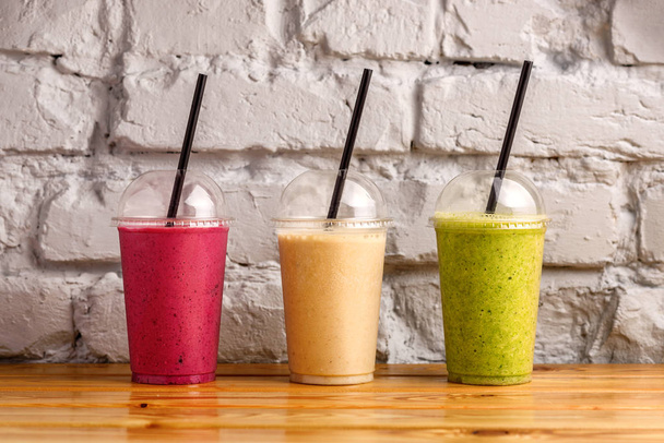 Fresh fruit smoothies in vibrant colors. - Photo, Image