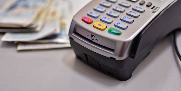 Bank terminal for payment purchases in store by credit cards and paper check receipt. Device for processing payments e-commerce - Valokuva, kuva