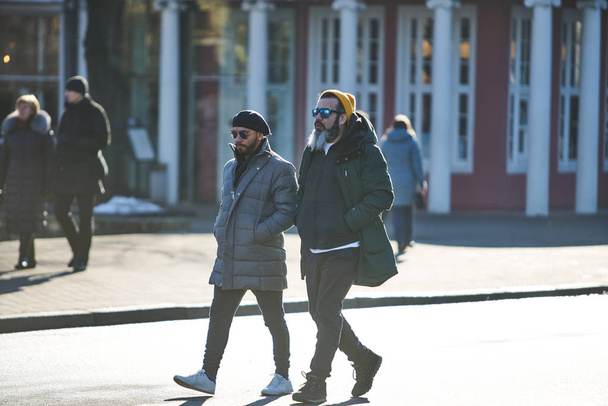 12-10-2018 RIga, Latvia Two mans walking at olt town street - Photo, Image