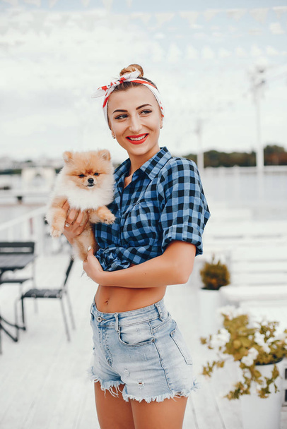 Stylish pin up girl with the little dog - Foto, Imagem