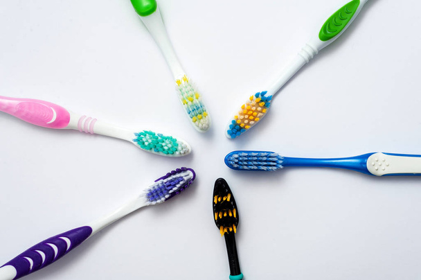Various toothbrushes on a white backgroun - Photo, Image
