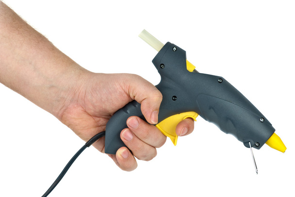 Hand holding glue gun - Photo, Image