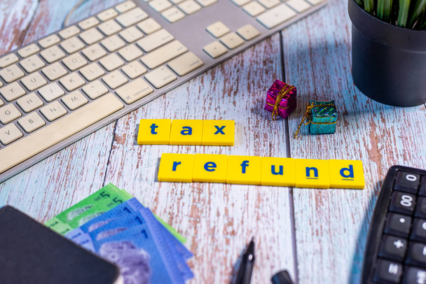 Tax Refund Concept - Calculator, keyboard, Ringgit Malaysia on b - Фото, зображення