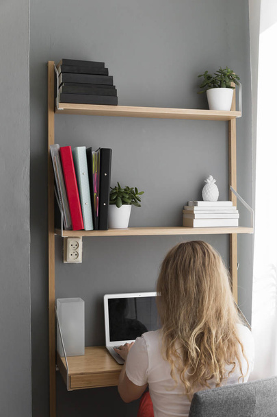 Remote Worker Sitting At Her Desk Reviewing Documents - Photo, Image