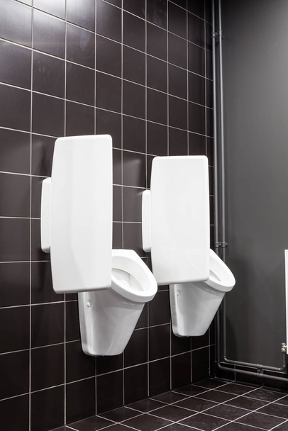 urinal on the wall - Фото, изображение