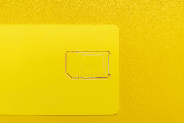 new sim card isolated on color surface, contract provider chip - Fotoğraf, Görsel