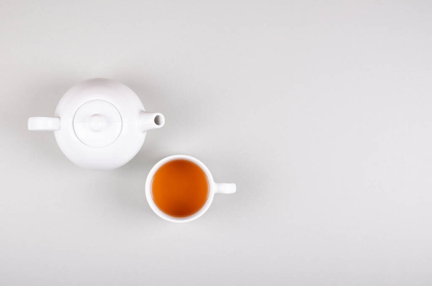 Tea cup composition on gray background. Flat lay. - 写真・画像
