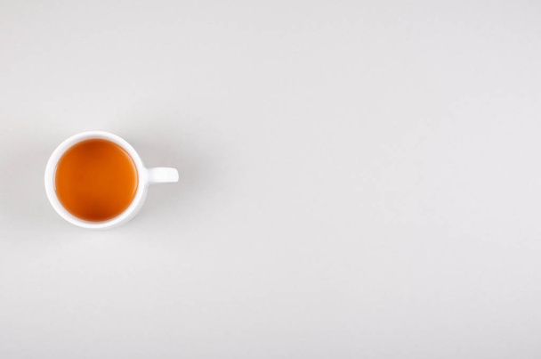 Tea cup composition on gray background. Flat lay. - Photo, image