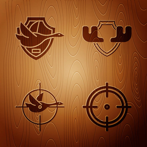 Set Target sport for shooting competition, Flying duck on shield, Hunt on duck with crosshairs and Moose horns on shield on wooden background. Vector - ベクター画像