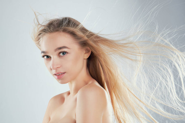 Beautiful woman with fluttering hair isolated. on white background natural beauty portrait an attractive sexual girl. - 写真・画像