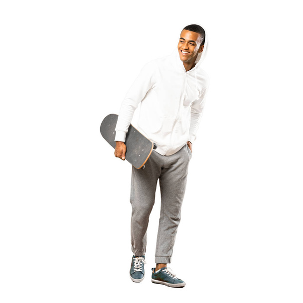 Full-length shot of Afro American skater man over isolated white - Фото, зображення