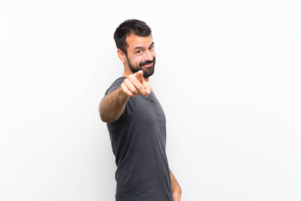 Young handsome man over isolated white background points finger at you with a confident expression - Photo, Image