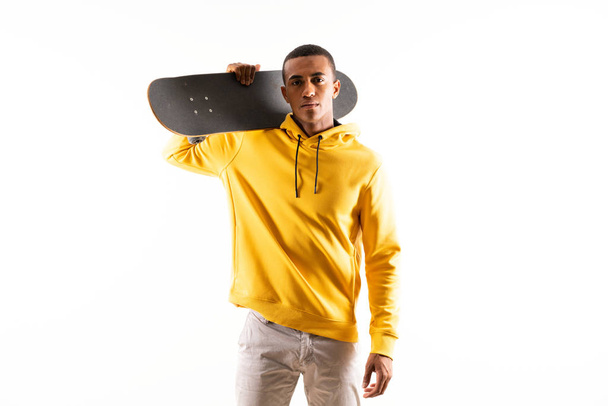 Afro American skater man over isolated white background - Foto, afbeelding