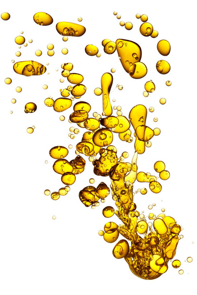 Splash του κίτρινου ελαίου στο νερό. - Φωτογραφία, εικόνα