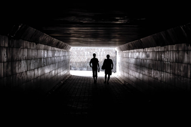 two human silhouettes in the tunel - Foto, Imagen