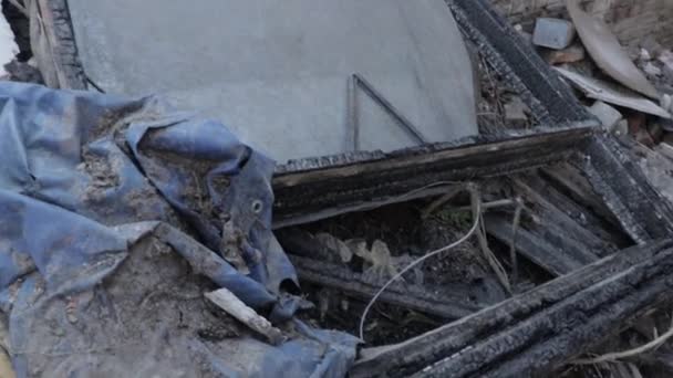 Building demolition. Slow Mo. Using an excavator to demolish a multi flat house. Twisted rebars, broken pillars and scattering concrete dust - Footage, Video