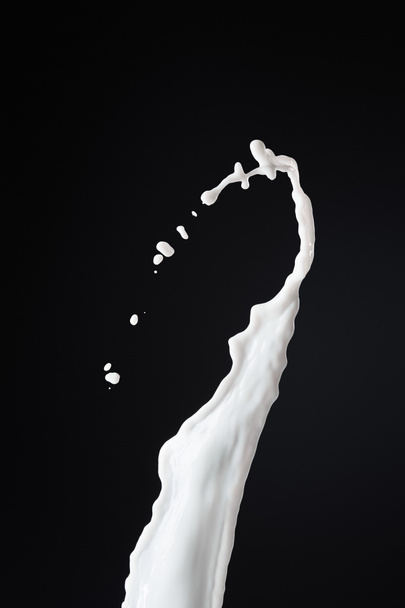 fresh white milk splash with drops isolated on black - Fotoğraf, Görsel