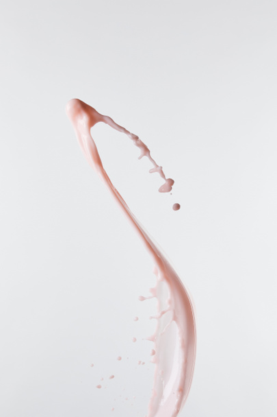 fresh pink milk splash with drops isolated on white - Foto, immagini
