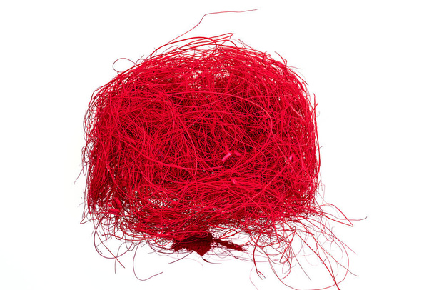 a ball of red colored flax hair ribbon isolated on white backgro - Photo, Image