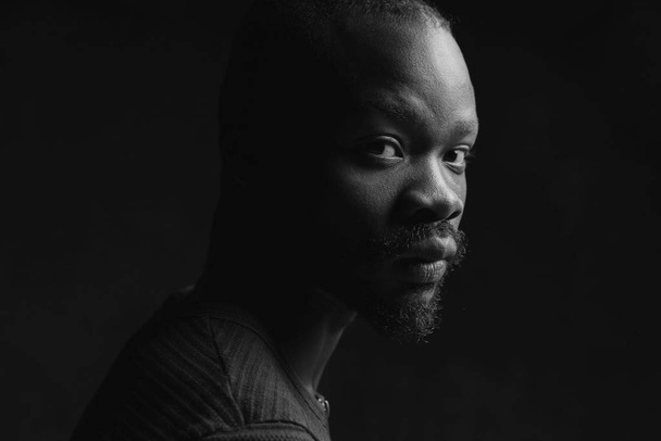 black and white portrait of a black handsome guy looking at the camera - Fotografie, Obrázek