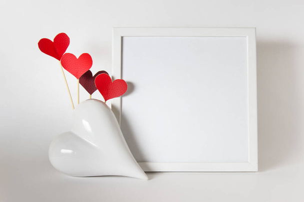Valentine day mockup empty frame white porcelain heart and red f - Photo, Image