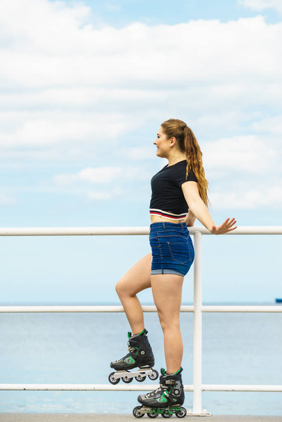 Girl wearing roller skates on seaside - Fotografie, Obrázek