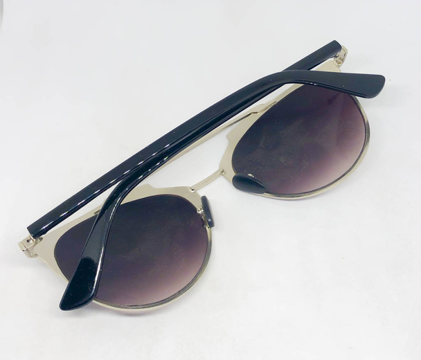 Assortment of sunglasses, white background - 写真・画像