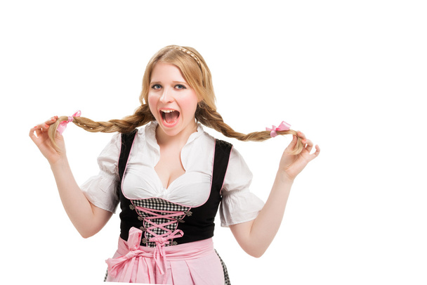 Young Bavarian woman in dirndl. - Фото, изображение