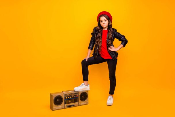 Full length body size view of nice attractive trendy long-haired girl in streetstyle holding leg on boombox pop rock heavy metal party isolated over bright vivid shine vibrant yellow color background - Fotoğraf, Görsel