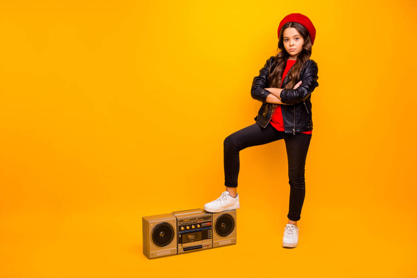 Full length body size view of nice attractive trendy fashionable long-haired girl in streetstyle standing near boombox folded arms isolated over bright vivid shine vibrant yellow color background - Foto, afbeelding