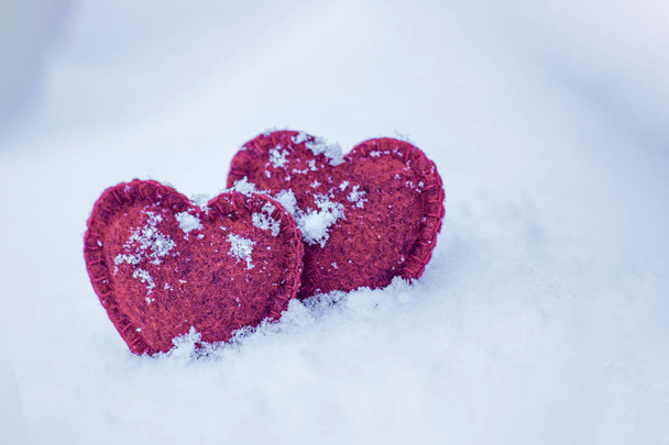 two textile hearts side by side in the snow, I love you concept, Valentines day card - Valokuva, kuva