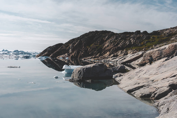 Beautifull landscape with floating icebergs in glacier lagoon and lake in Greenland. Ilulissat Icefjord Glacier. Iceberg and ice from glacier in arctic nature landscape. - Zdjęcie, obraz