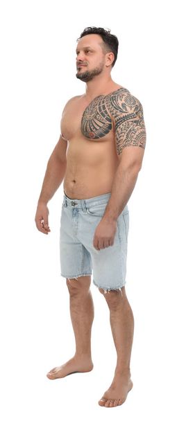 Full length portrait of shirtless man on white background - Photo, image