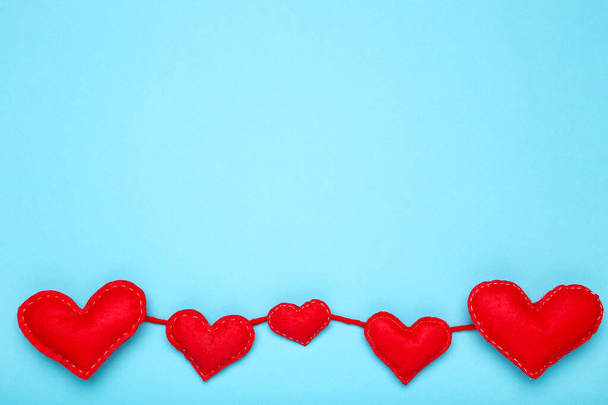 Fabric hearts on blue background - Fotografie, Obrázek