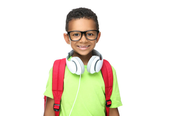 Young African American school boy in headphones with backpack on - Foto, Imagen