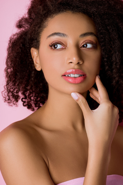 attractive thoughtful african american girl with dental braces, isolated on pink - Foto, Imagem
