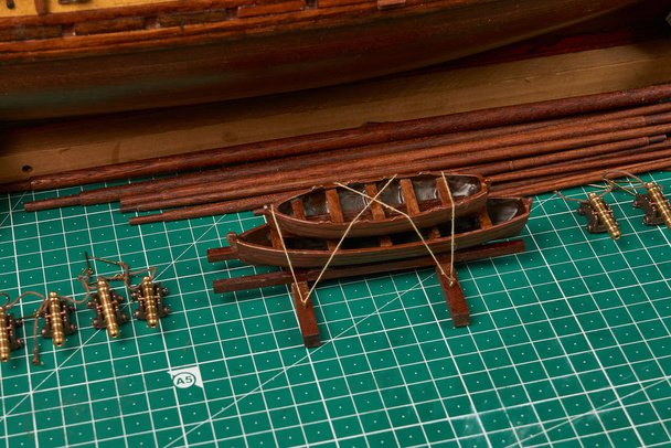 Ship model building in progress. Assembly of ship model from wood - Photo, Image