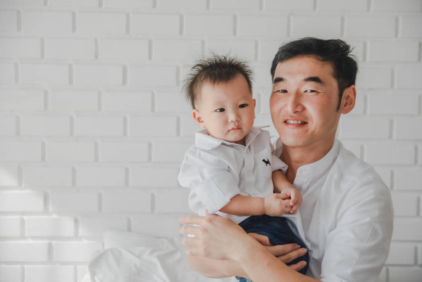 Asian Japanese Family father mother son wearing white shirt carr - Foto, immagini