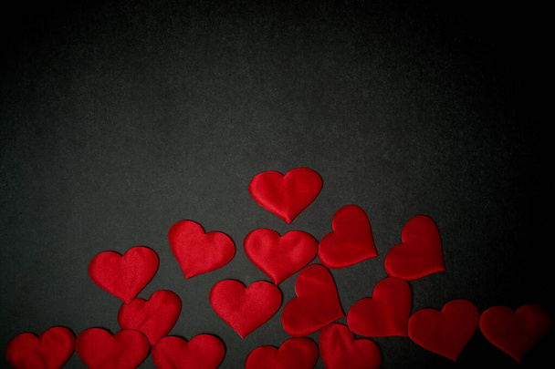 Valentines day,a Declaration of love.Lots of red hearts on a dark graphite background. - Photo, Image