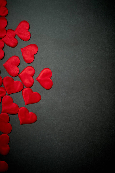 Valentines day,a Declaration of love.Lots of red hearts on a dark graphite background. - Photo, image