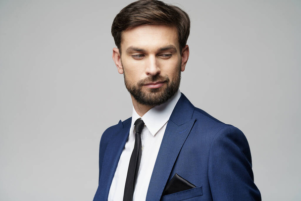 studio photo of young handsome stylish businessman wearing suit - 写真・画像