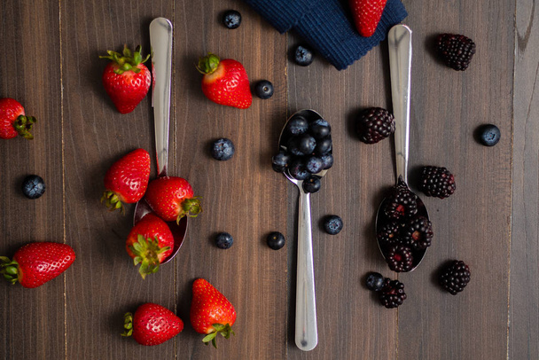 Close-up image of berries isolated, blueberry, strawberry, blackberry - Photo, Image