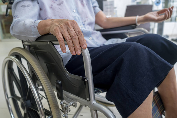 Senior woman on wheelchair in the hospital. - Фото, зображення