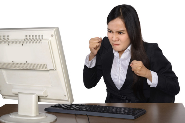 Businesswoman getting crazy in front of her laptop - Zdjęcie, obraz